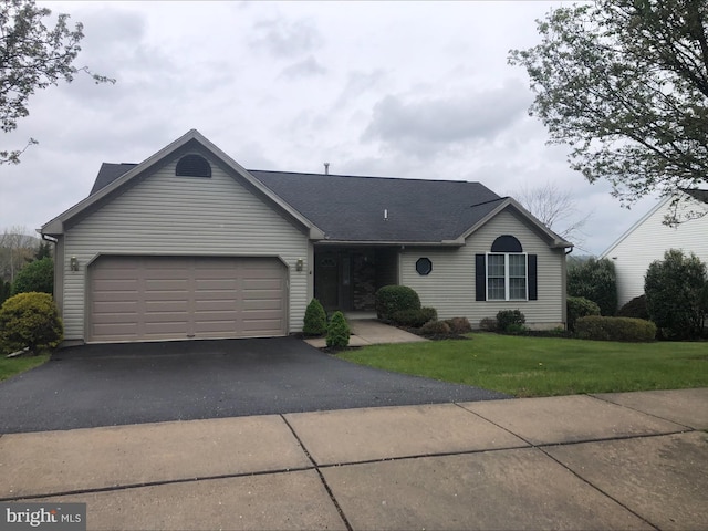 4741 Dunham Dr, Reading, PA 19606 - ranch-style home with a garage, roof with shingles, a front lawn, and aphalt driveway