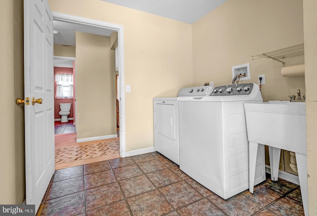 4741 Dunham Dr, Reading, PA 19606 - clothes washing area featuring separate washer and dryer, baseboards, and laundry area