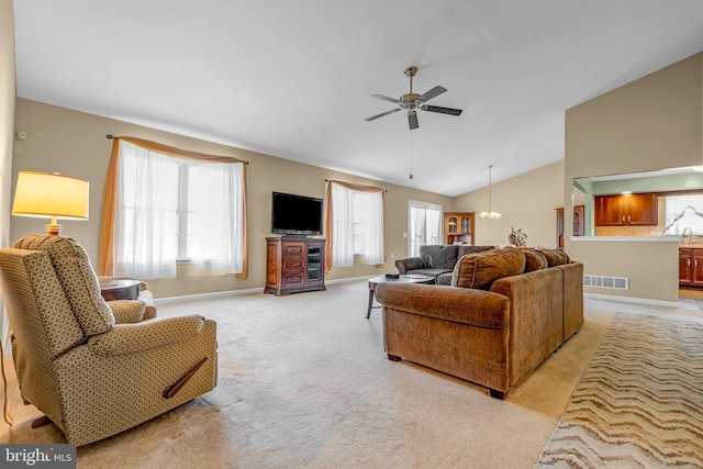 4741 Dunham Dr, Reading, PA 19606 - living area featuring visible vents, lofted ceiling, ceiling fan, light colored carpet, and a wealth of natural light