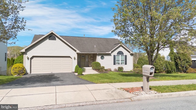 4741 Dunham Dr, Reading, PA 19606 - single story home with a garage, driveway, a front yard, and a shingled roof