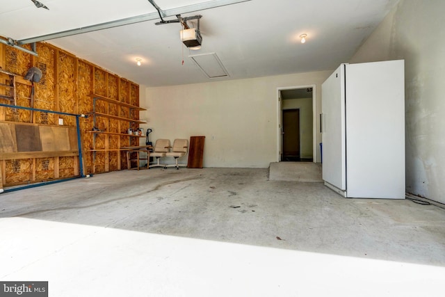 4741 Dunham Dr, Reading, PA 19606 - garage with freestanding refrigerator and a garage door opener