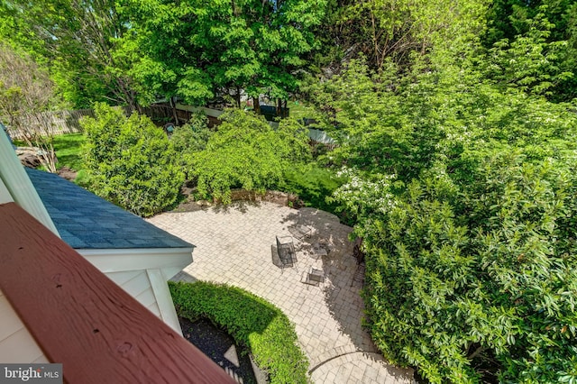 exterior view of fence and a shingled roof