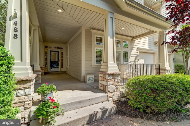 view of exterior entry with a porch