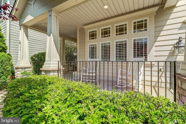doorway to property featuring covered porch