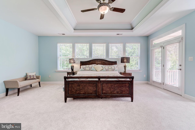 bedroom with a raised ceiling, ornamental molding, access to outside, light colored carpet, and baseboards
