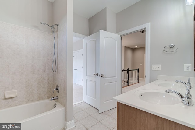 bathroom featuring shower / bath combination, tile patterned flooring, and double vanity