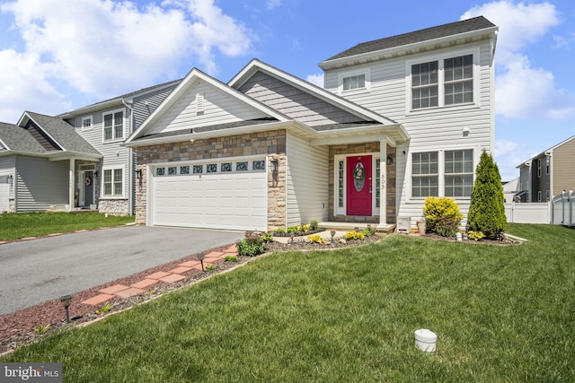 view of front of property featuring a front lawn, aphalt driveway, fence, stone siding, and an attached garage