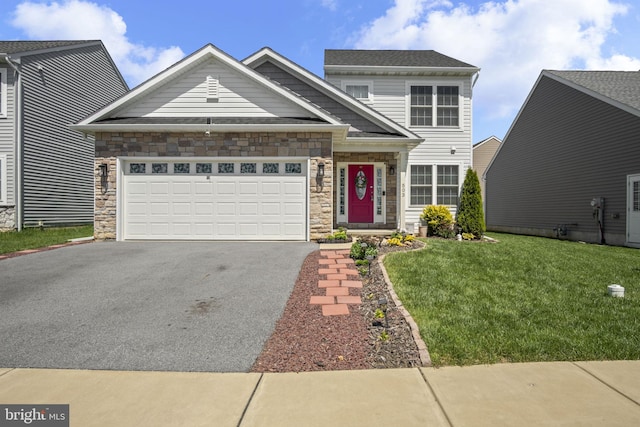 traditional-style home with an attached garage, a front yard, driveway, and stone siding