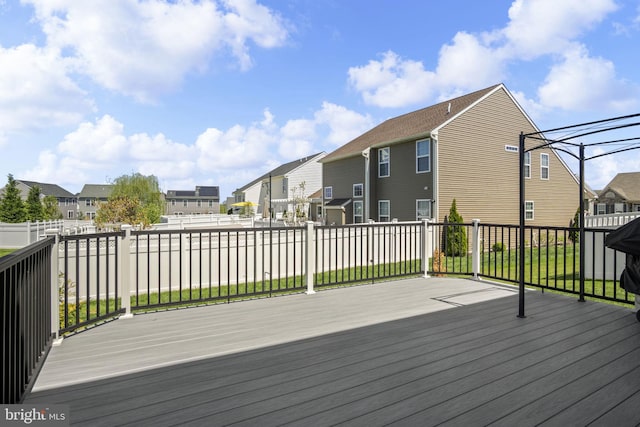 wooden deck featuring a residential view
