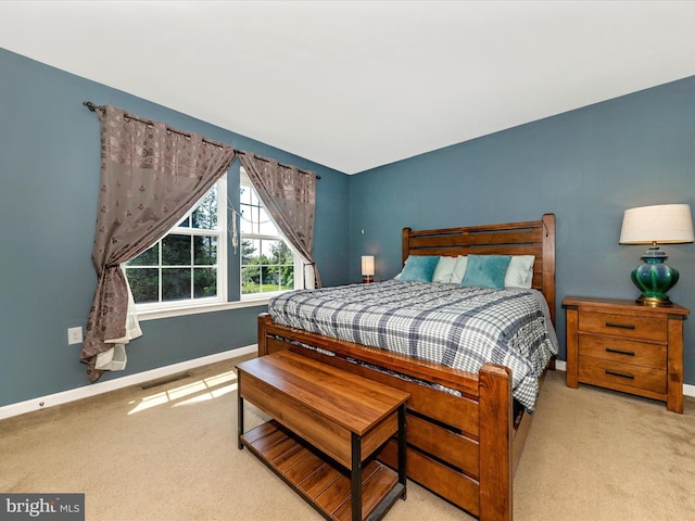 bedroom featuring visible vents, carpet flooring, and baseboards