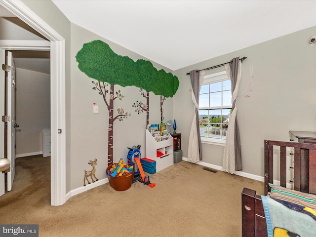 playroom with visible vents, carpet floors, and baseboards