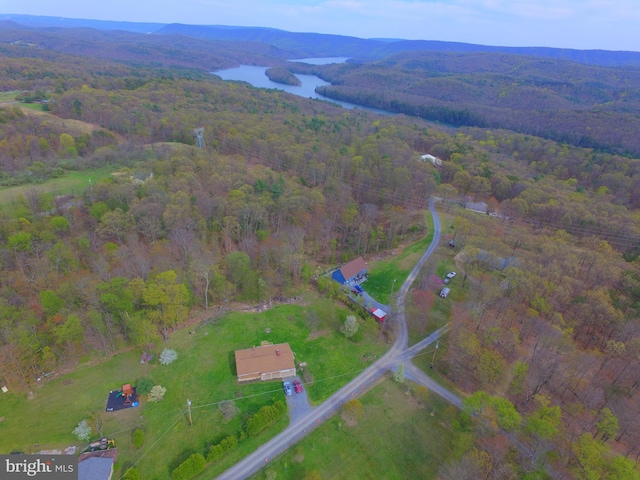 bird's eye view with a water and mountain view and a forest view