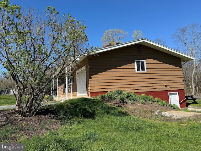 view of property exterior featuring a yard