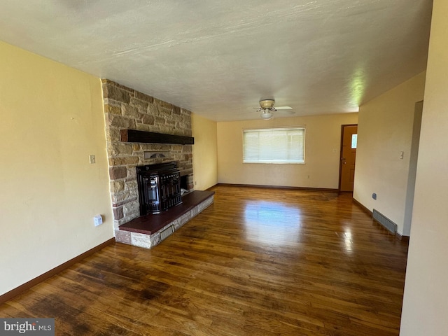 unfurnished living room with baseboards, wood finished floors, and a ceiling fan