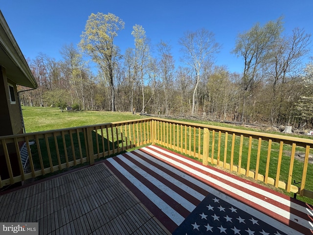 deck featuring a yard
