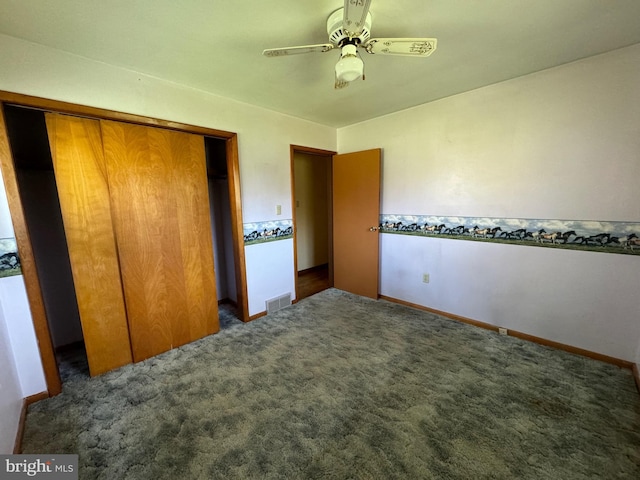 unfurnished bedroom with a closet, carpet flooring, baseboards, visible vents, and a ceiling fan