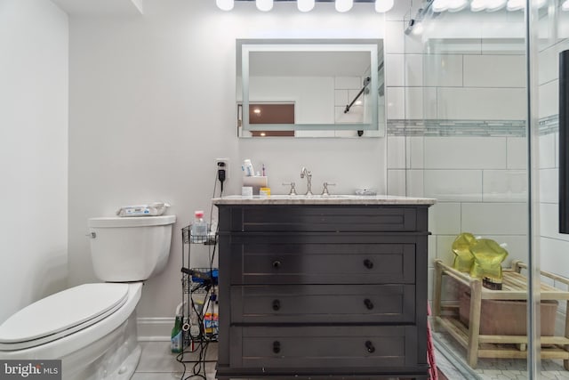 full bath with walk in shower, baseboards, vanity, and toilet
