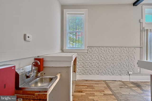 interior details with a sink and wood finished floors