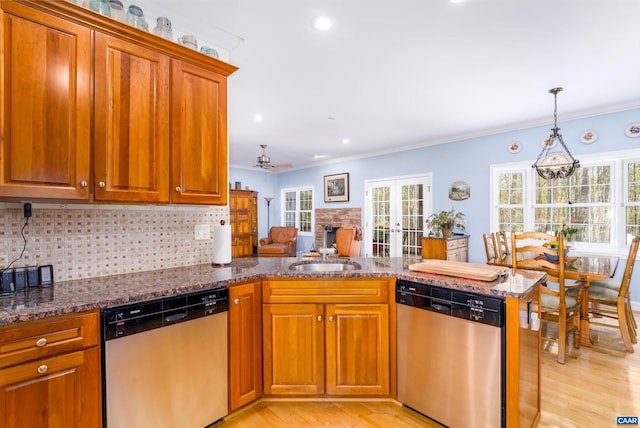 kitchen with stainless steel dishwasher, brown cabinetry, light wood-style flooring, and decorative backsplash