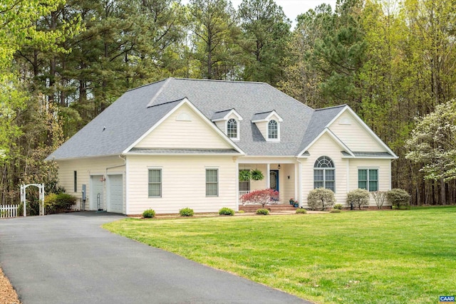 cape cod house featuring a porch, driveway, a front lawn, and a garage