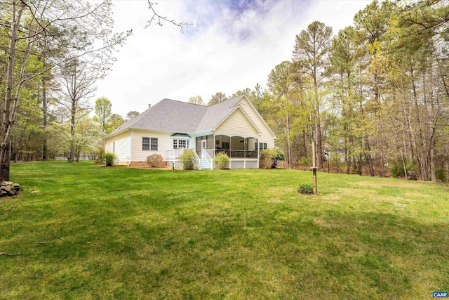 rear view of house with a lawn