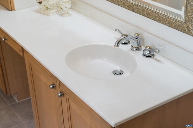 bathroom with tile patterned flooring and vanity