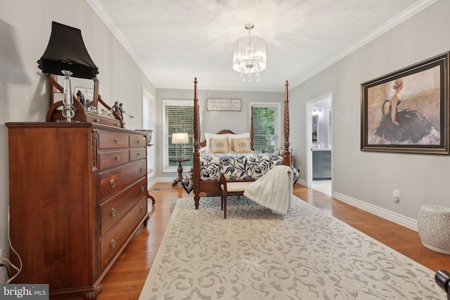 14595 Limestone Dr, Swan Point, MD 20645 - bedroom featuring a chandelier, ornamental molding, baseboards, wood finished floors, and ensuite bath
