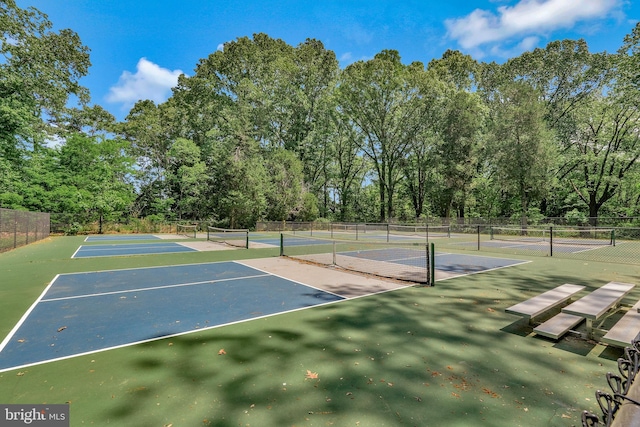 14595 Limestone Dr, Swan Point, MD 20645 - view of tennis court with community basketball court, fence, and view of scattered trees
