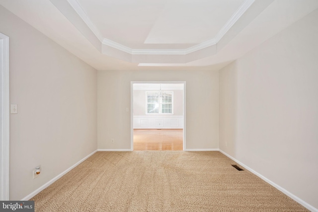 168 Sequester Dr, Stafford, VA 22556 - carpeted empty room with a tray ceiling, crown molding, baseboards, and a chandelier