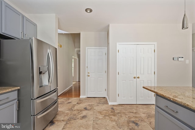 168 Sequester Dr, Stafford, VA 22556 - kitchen featuring stainless steel fridge, gray cabinetry, light stone counters, and decorative light fixtures