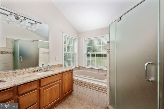 168 Sequester Dr, Stafford, VA 22556 - full bath with lofted ceiling, tile patterned floors, a stall shower, a bath, and double vanity