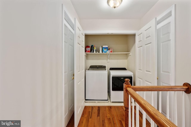 168 Sequester Dr, Stafford, VA 22556 - laundry area with washer and dryer and wood finished floors