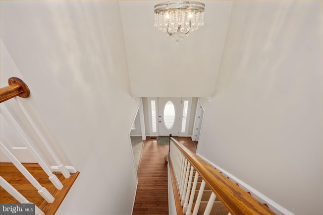 168 Sequester Dr, Stafford, VA 22556 - foyer featuring a chandelier, a towering ceiling, stairs, wood finished floors, and baseboards