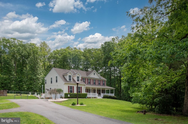 168 Sequester Dr, Stafford, VA 22556 - colonial home featuring a porch, asphalt driveway, and a garage