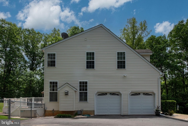 168 Sequester Dr, Stafford, VA 22556 - view of home's exterior featuring an attached garage and asphalt driveway