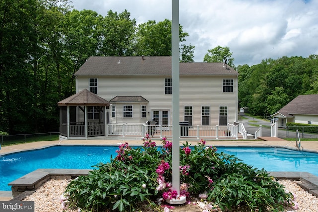 168 Sequester Dr, Stafford, VA 22556 - view of pool featuring a gazebo, fence, and view of wooded area