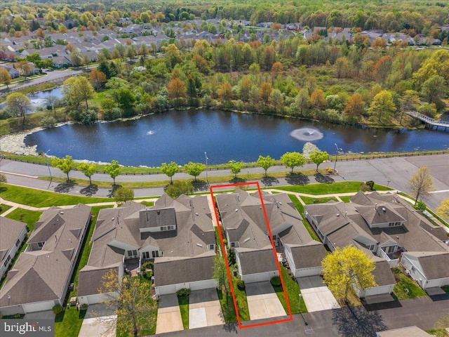 bird's eye view with a water view, a residential view, and a forest view