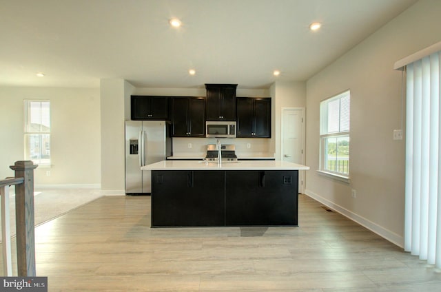 110 Fletcher Cir, Middletown, DE 19709 - kitchen with appliances with stainless steel finishes, light countertops, an island with sink, healthy amount of natural light, and recessed lighting
