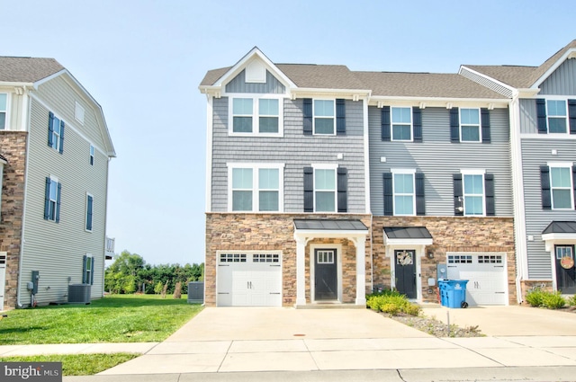 110 Fletcher Cir, Middletown, DE 19709 - multi unit property with a garage, concrete driveway, and stone siding