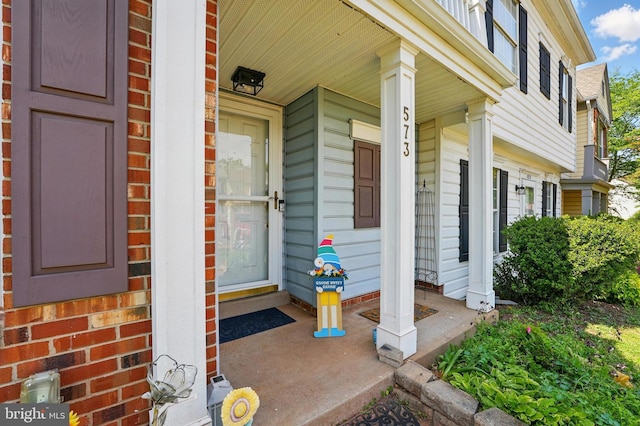 doorway to property with covered porch