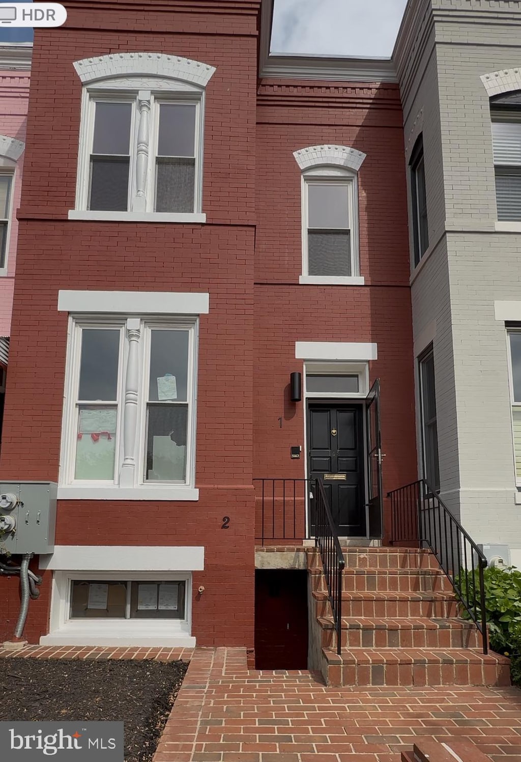 view of property with brick siding