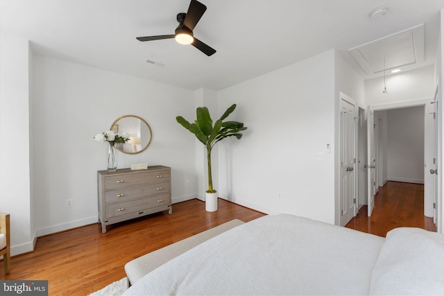 143 13th St NE, Washington, DC 20002 - bedroom with attic access, wood finished floors, baseboards, and a ceiling fan