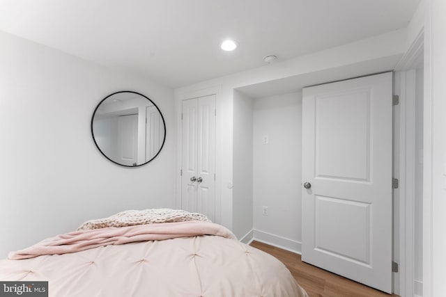 143 13th St NE, Washington, DC 20002 - bedroom with light wood-style floors, recessed lighting, baseboards, and a closet