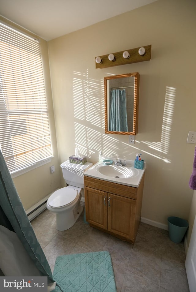 full bath featuring tile patterned flooring, a baseboard heating unit, toilet, vanity, and baseboards