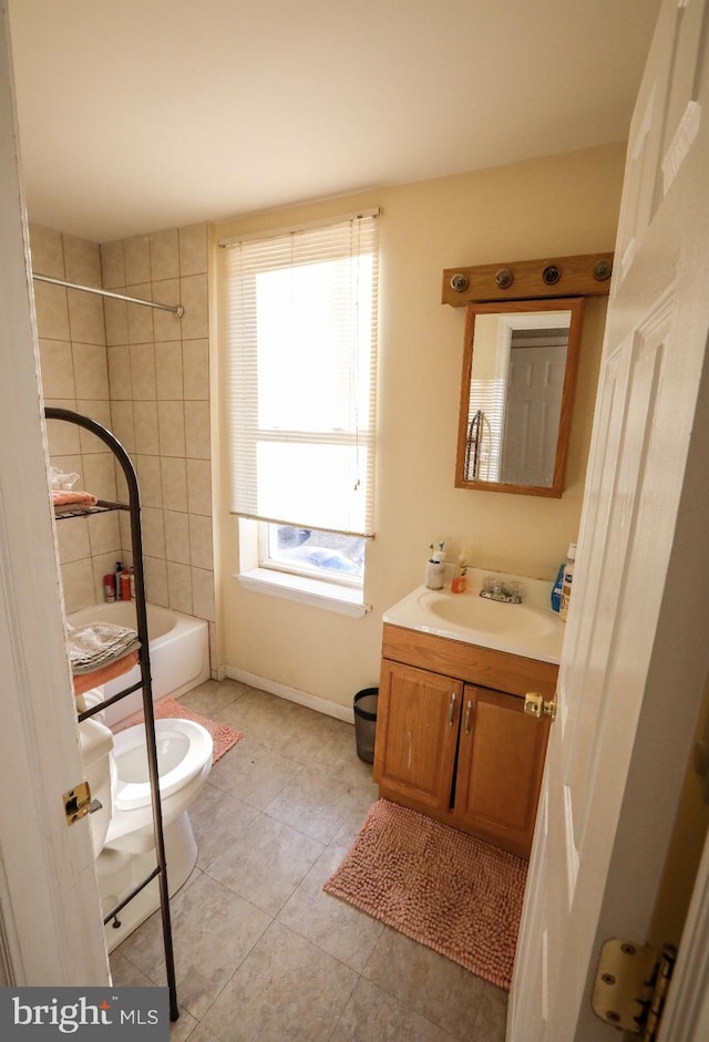 full bathroom featuring tile patterned floors, a healthy amount of sunlight, shower / bath combination, and vanity