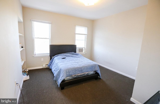 bedroom with carpet and baseboards
