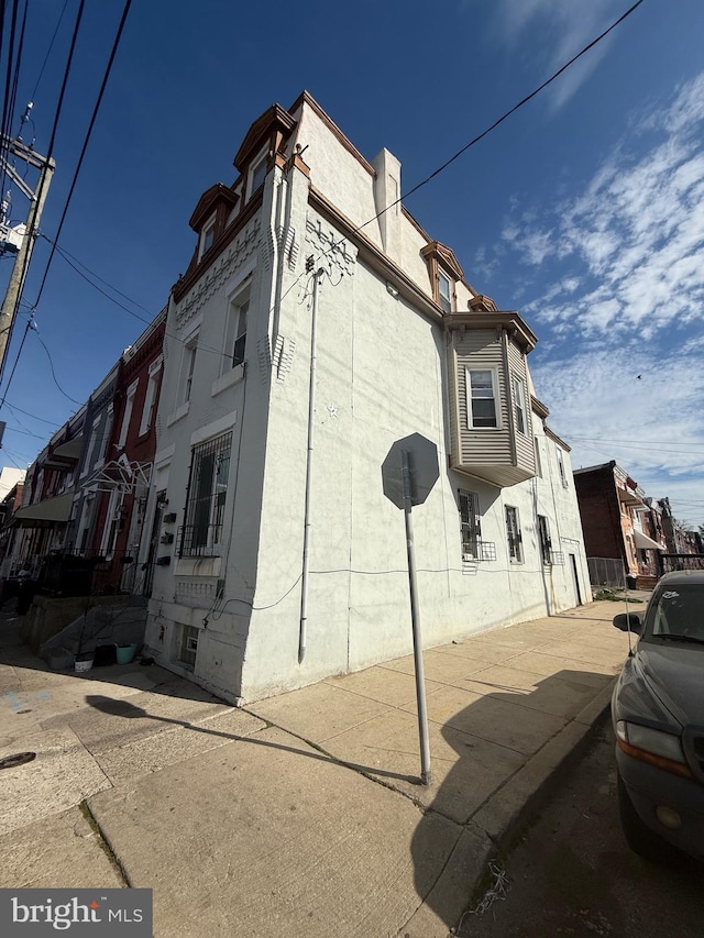 view of side of property featuring stucco siding
