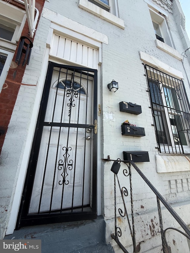entrance to property with brick siding