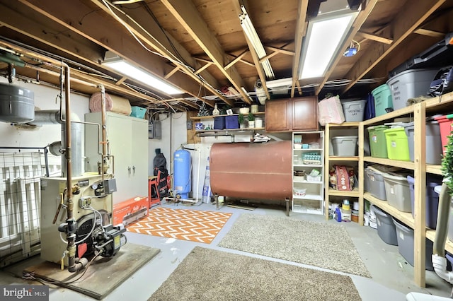 storage area featuring heating fuel and a heating unit