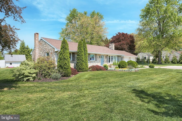 single story home with a garage, a chimney, stone siding, and a front lawn